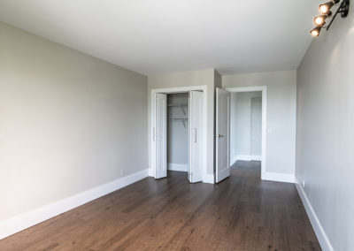 Spacious second bedroom with large closet space and new hardwood floors in apartment near NYC